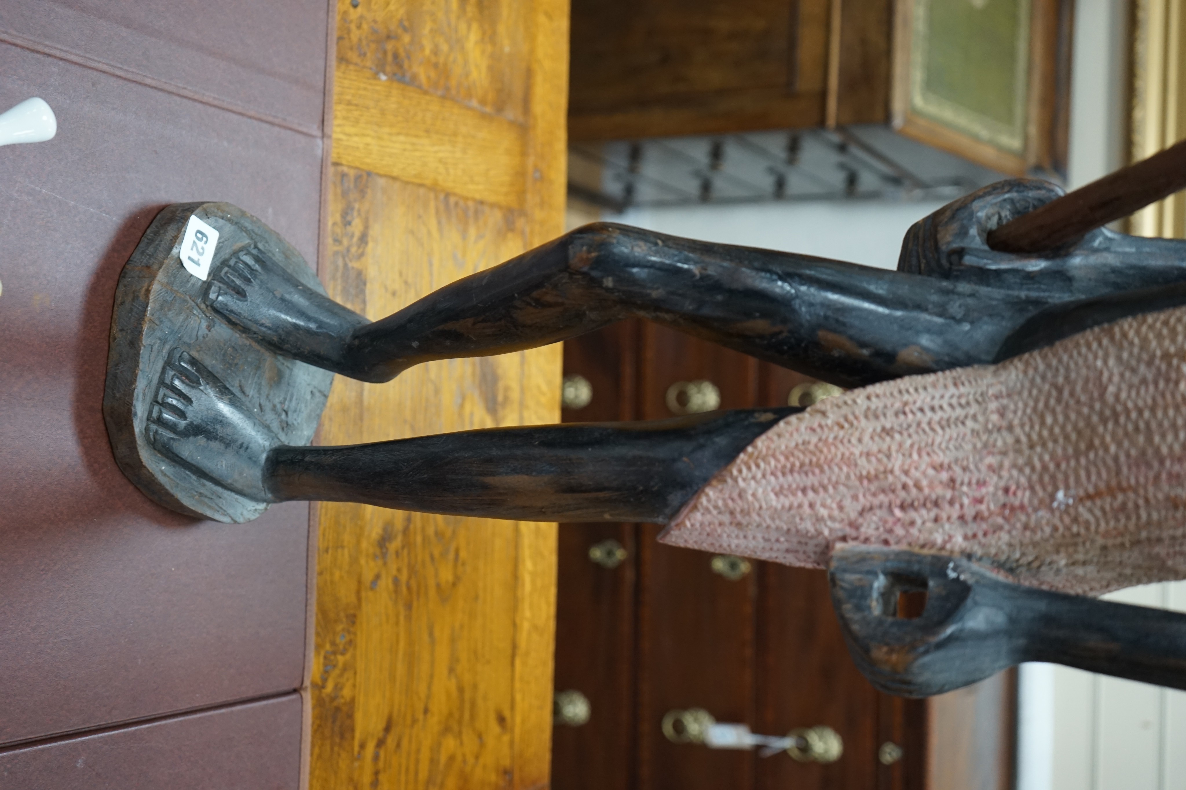 A tall West African carved figure of a warrior, 100cm